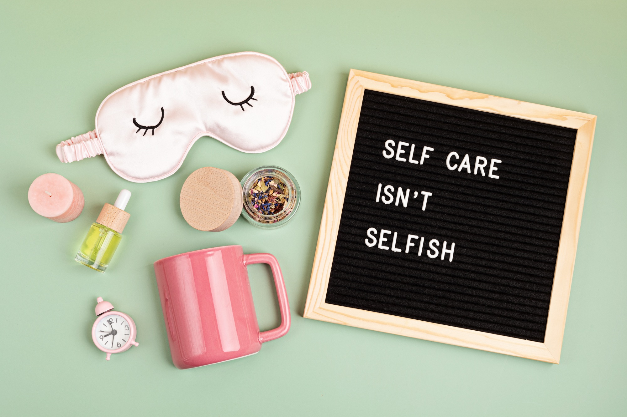 Self care is not selfish. Felt letter board with sleep optimization products, concept of rest